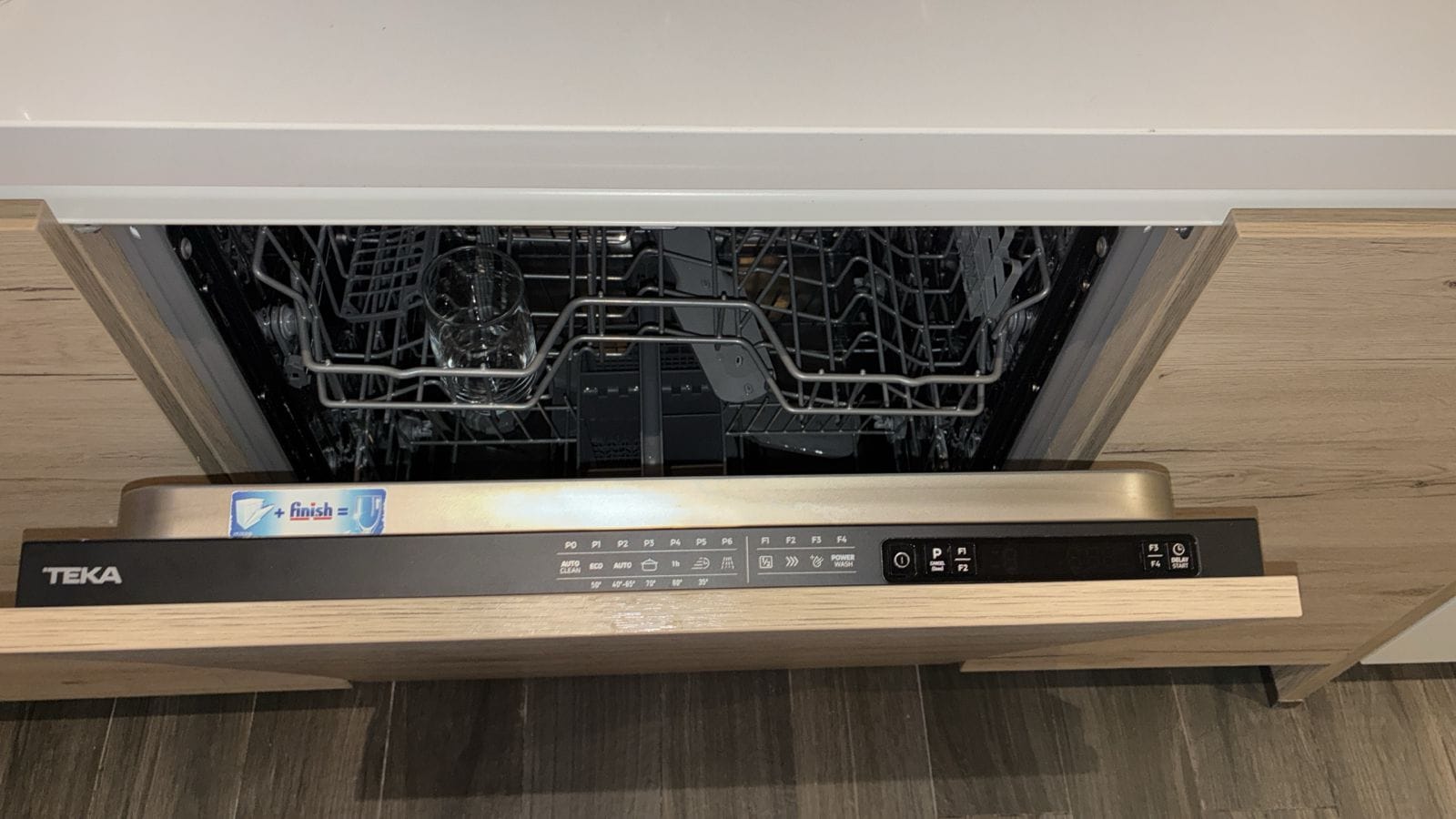 Fully integrated built-in dishwasher opened for diagnosis in the UAE