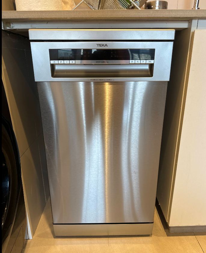 Freestanding stainless steel dishwasher repaired and tested in a Dubai kitchen