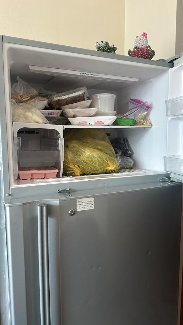 Refrigerator freezer compartment opened for diagnosis on a UAE service call