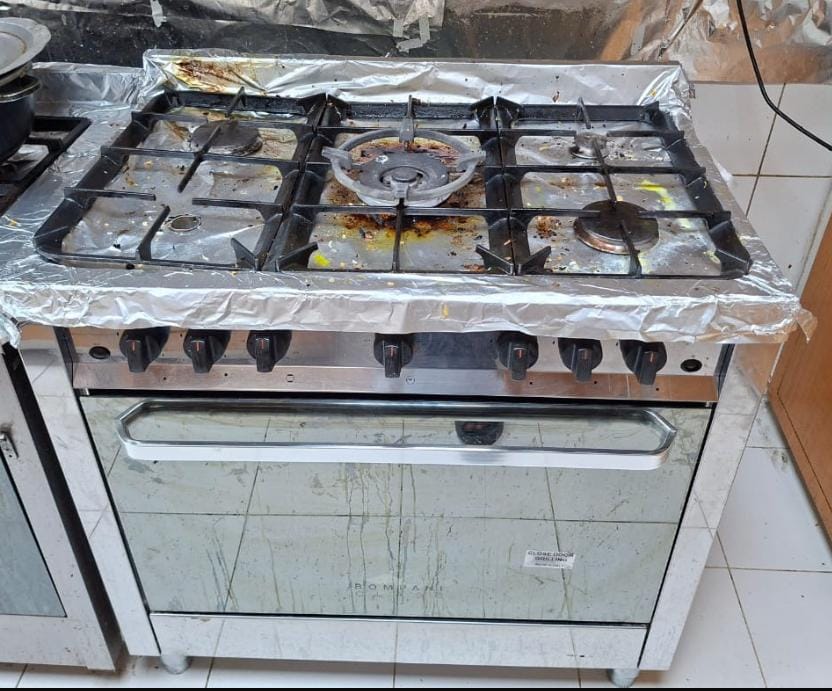 Five-burner gas cooking range before strip-down and service in the UAE