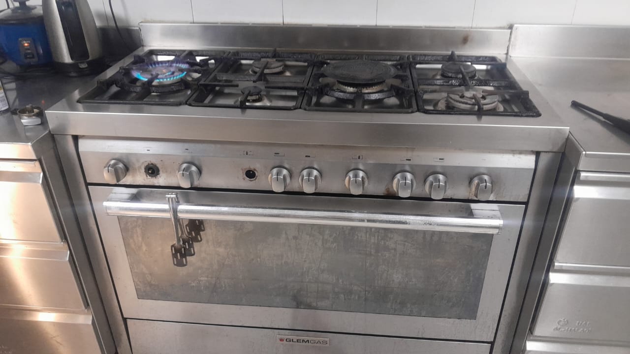 Gas range burner flame tested after service in the UAE