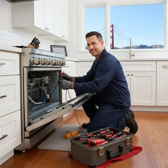 Technician diagnosing a gas range control panel with test equipment