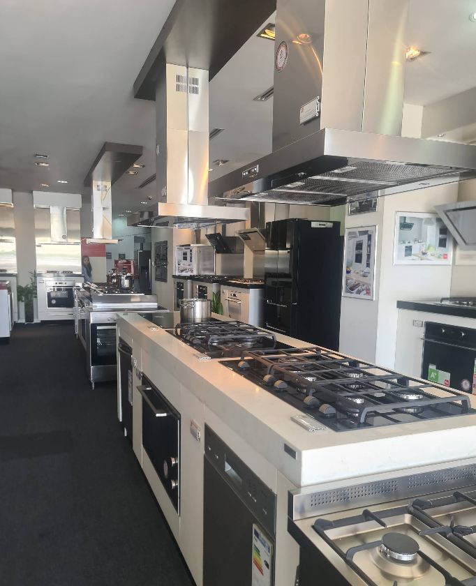 Home appliance showroom and service centre in Dubai with ovens, hobs and cooker hoods on display