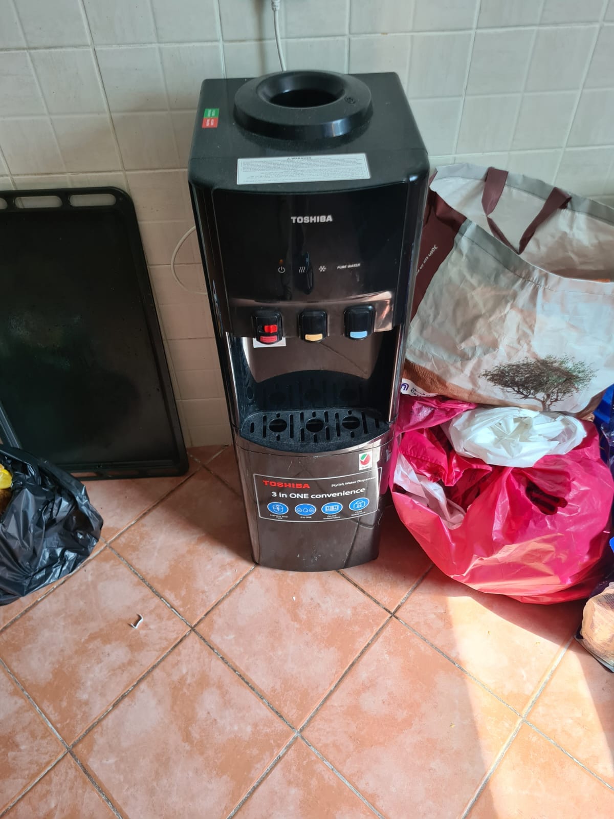 Free-standing hot and cold water dispenser attended on a UAE service call