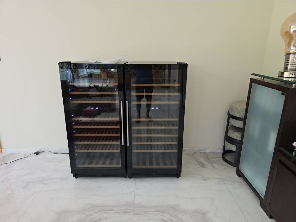 Two dual-zone wine coolers repaired and running in a Dubai villa
